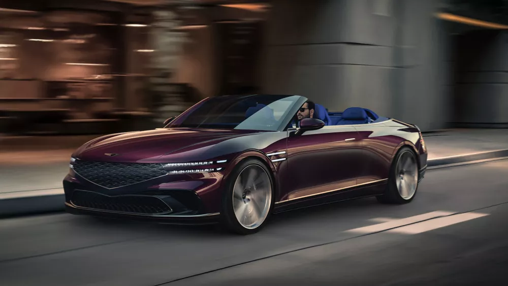 3/4 front driver side view of Genesis X Gran Convertible Concept vehicle driving through city