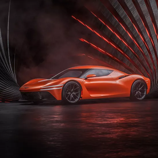 7/8 driver side profile of orange Genesis Magma GT Concept orange pinwheel lighting behind