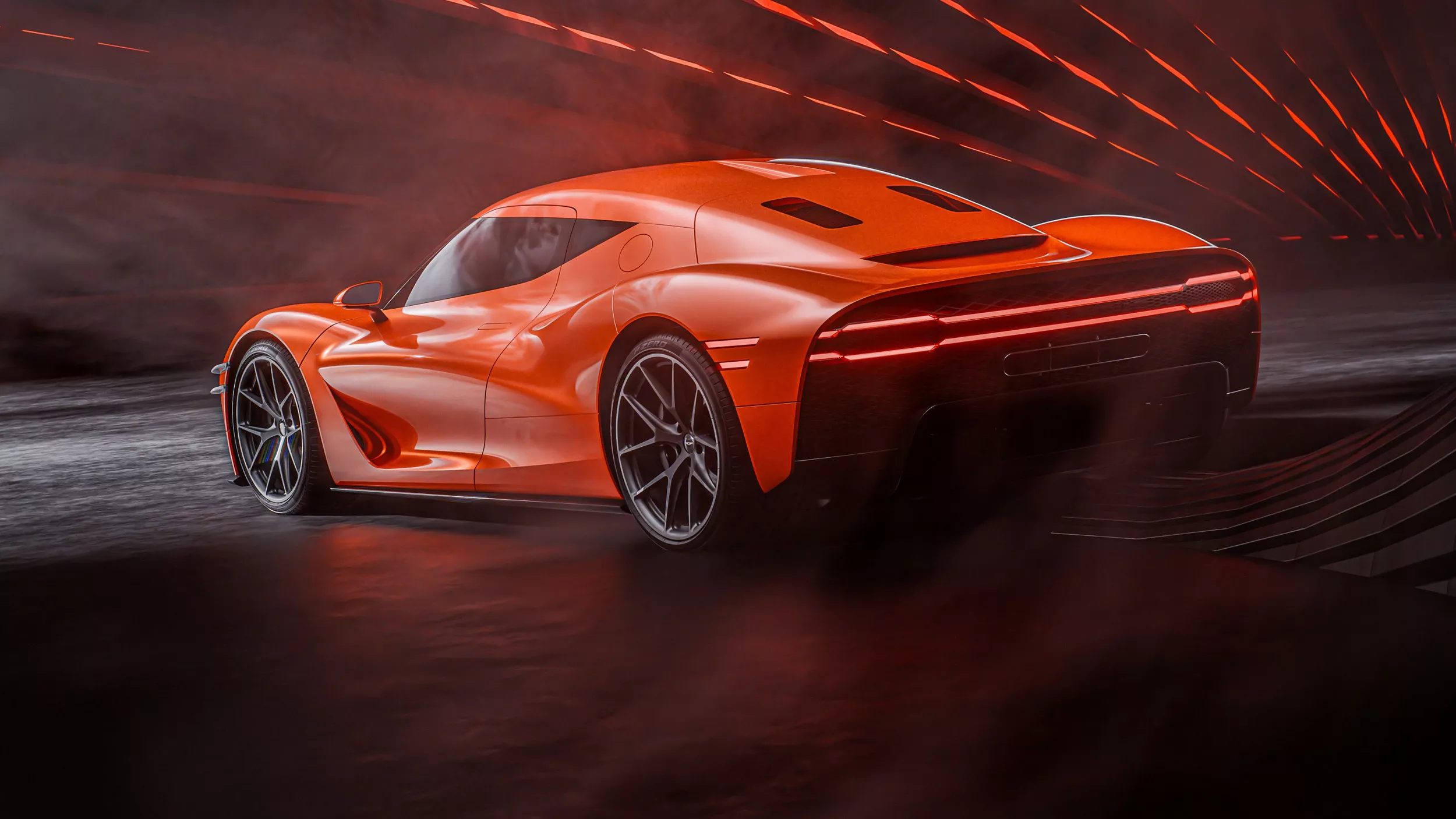 7/8 rear driver side view of orange Genesis Magma GT concept vehicle, pinwheel lighting behind