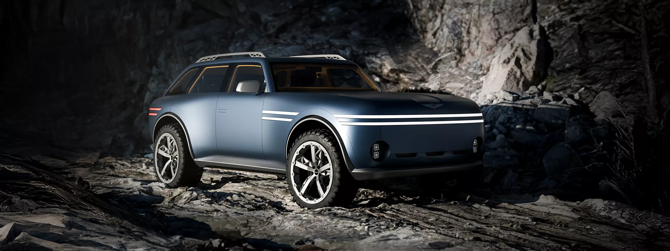 Passenger side 3/4 view of Genesis X Gran Equator Concept parked in a dim cave-like environment