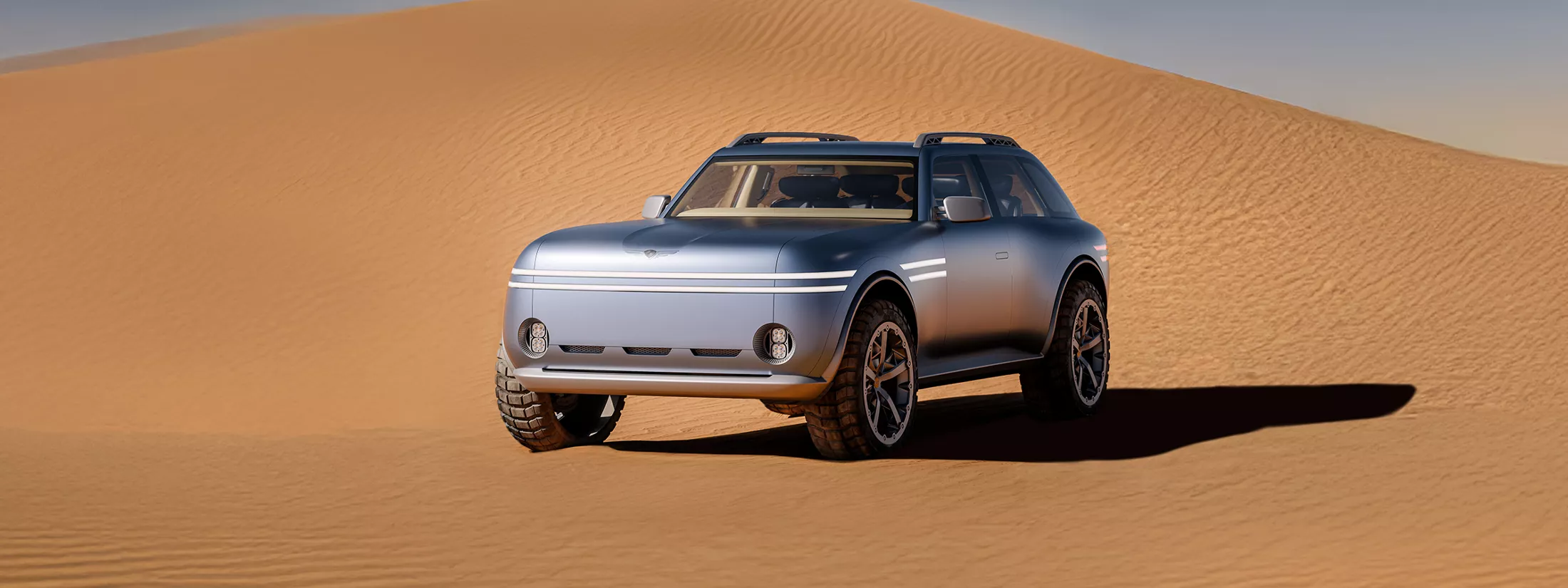 Driver side 3/4 view of Genesis X Gran Equator Concept parked on dessert sand dune