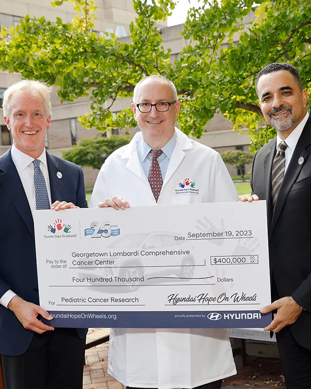 Check presentation with doctors and Hope On Wheels representatives