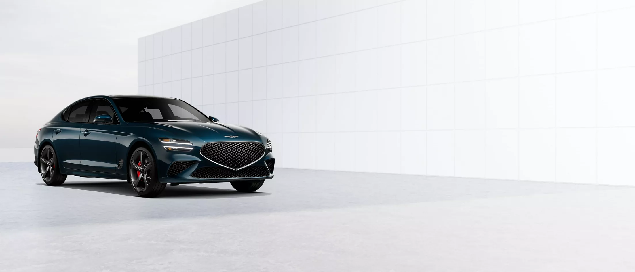 3/4 front driver side view of the Genesis G70 in Tasman Blue