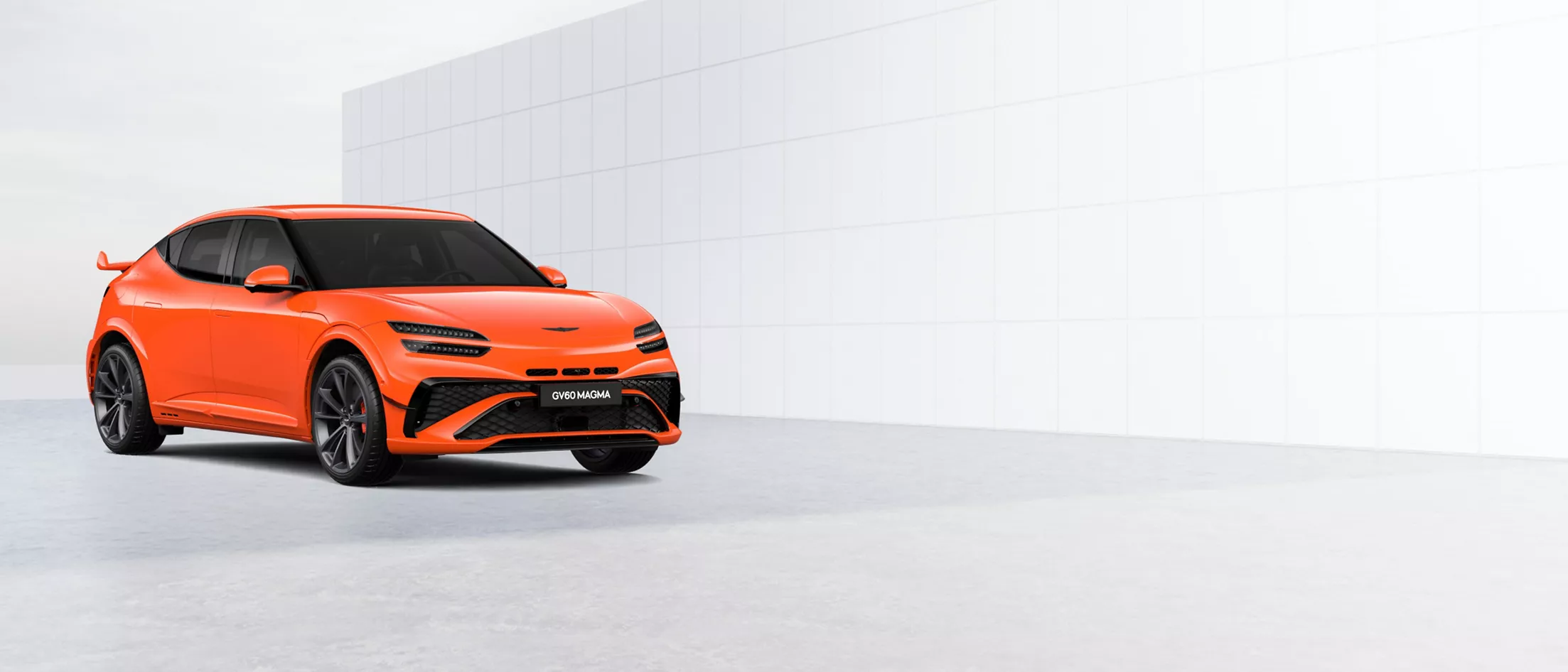 3/4 front passenger side view of 2026 Genesis GV60 Magma in Magma Orange