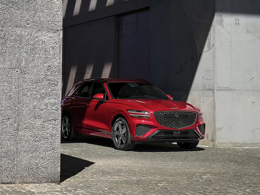 Genesis GV70 parked between concrete columns