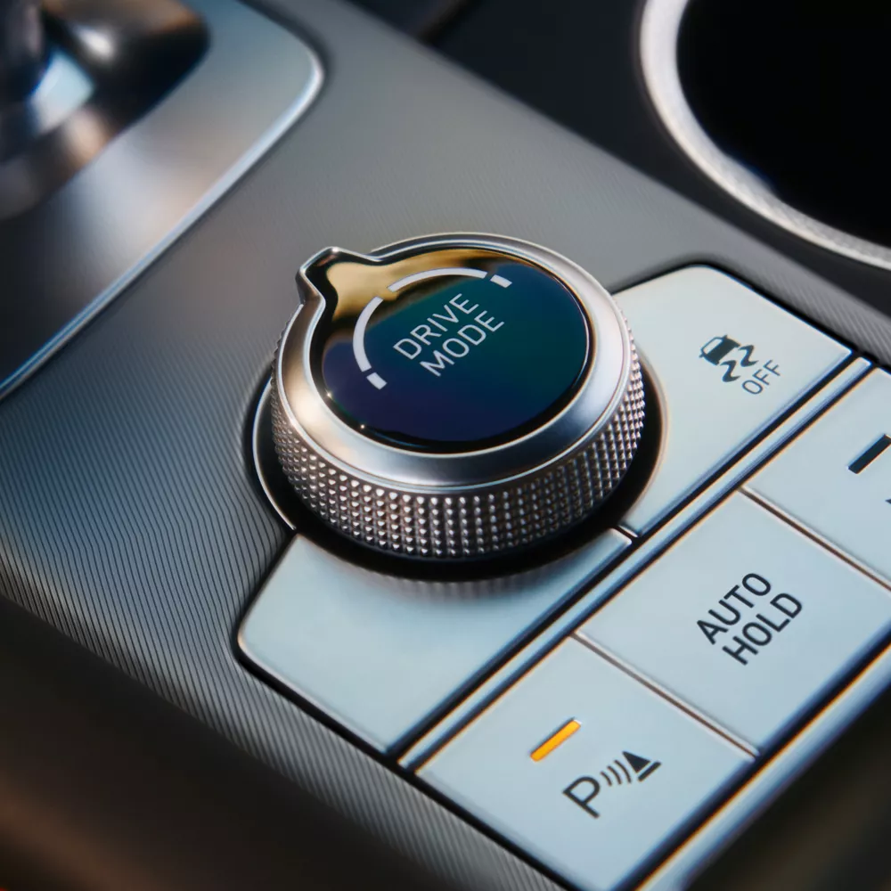 Interior close up of Drive Mode dial on center console of 2027 Genesis G70