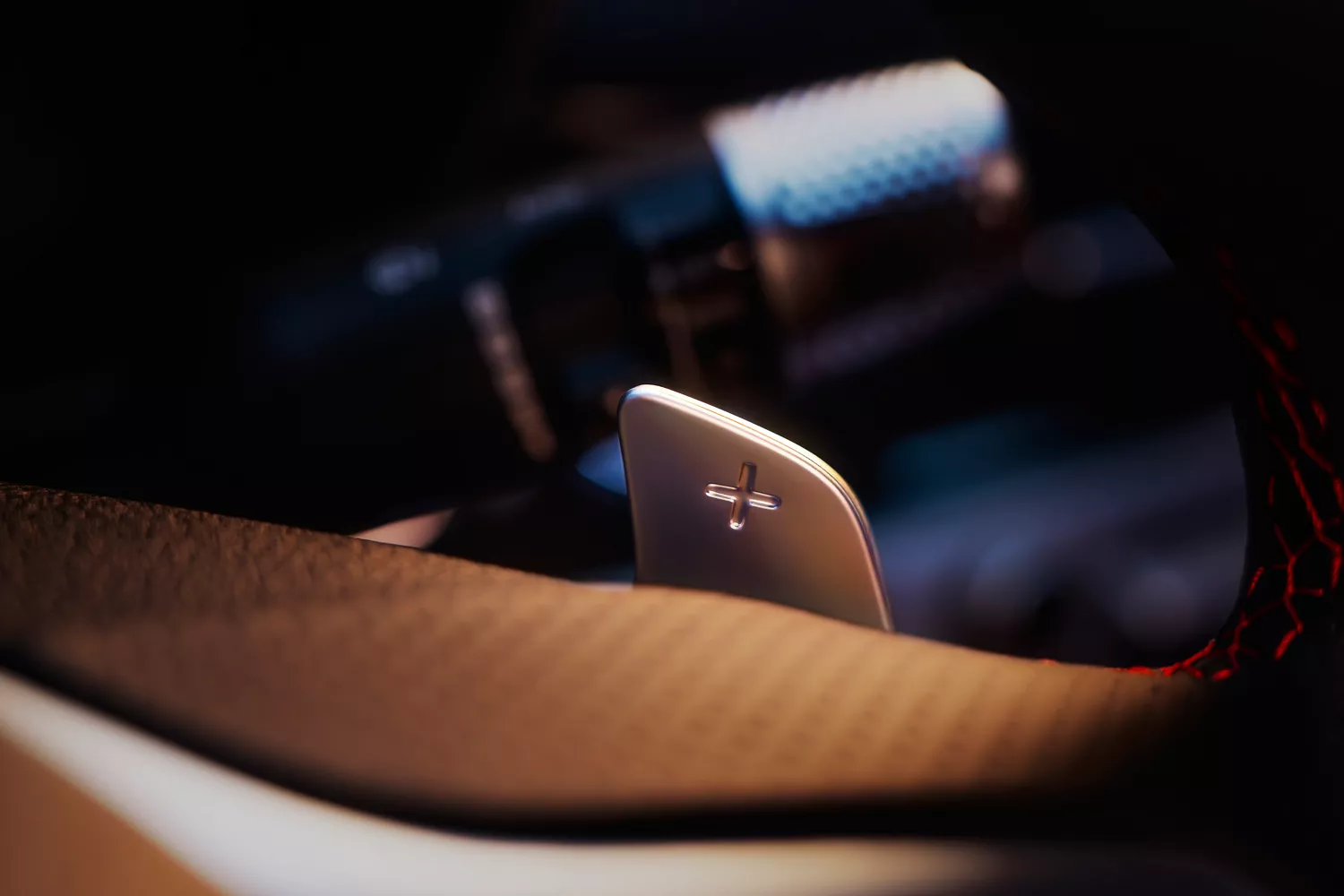 "Transmission" tab selected with interior close up of paddle shifter in Genesis G70