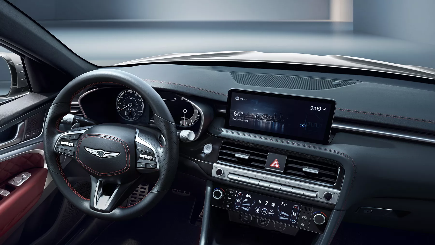 Interior view of Genesis G70 steering wheel and center console