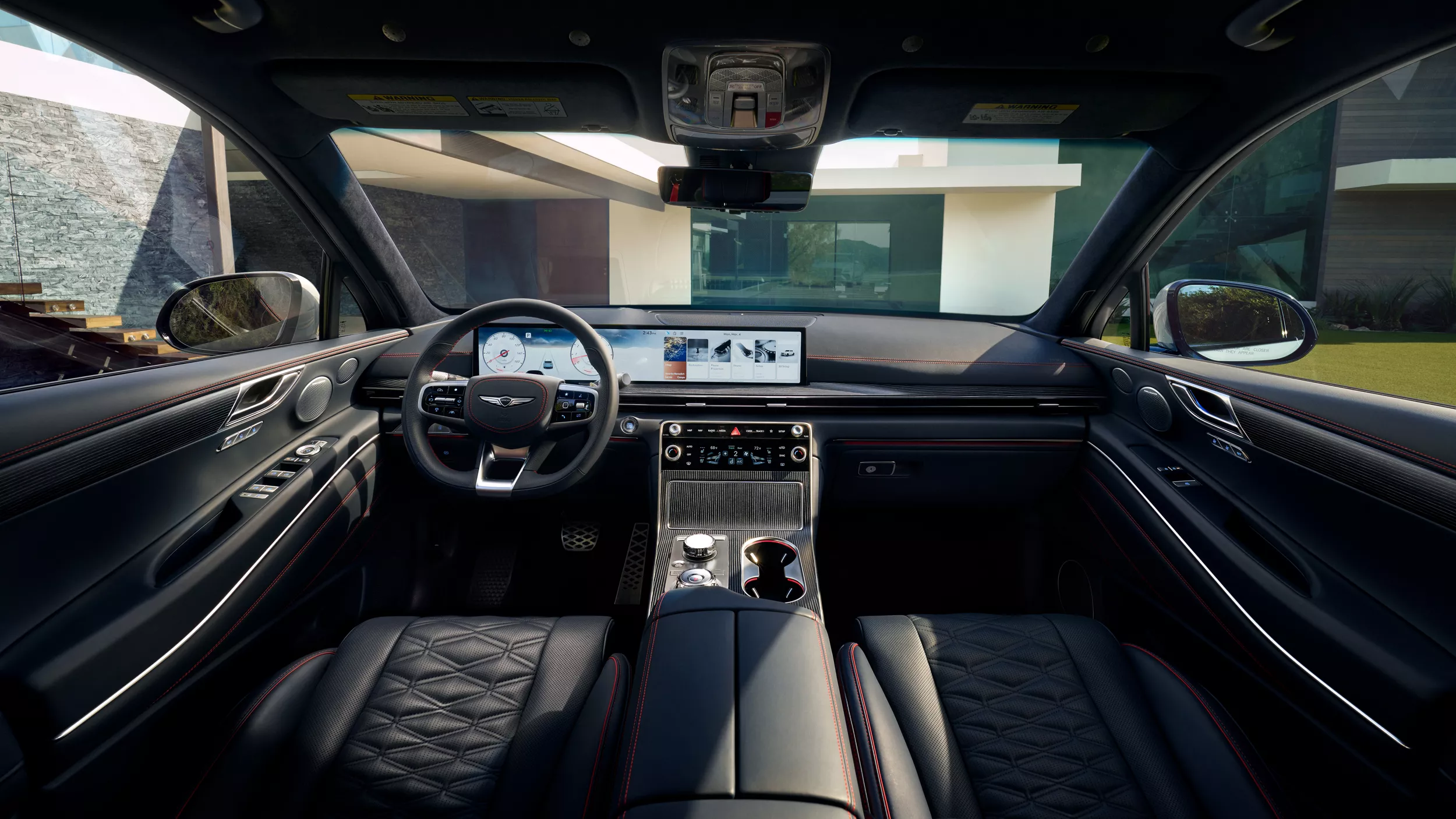 Interior view of Genesis GV80 Coupe from rear-seats of cockpit, leather seats and digital dash