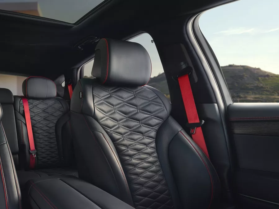 Interior view of Ultramarine Blue Nappa leather front and rear seating inside Genesis GV80 Coupe