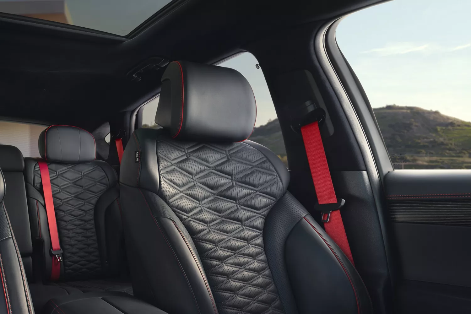 Interior view of Ultramarine Blue Nappa leather front and rear seating inside Genesis GV80 Coupe
