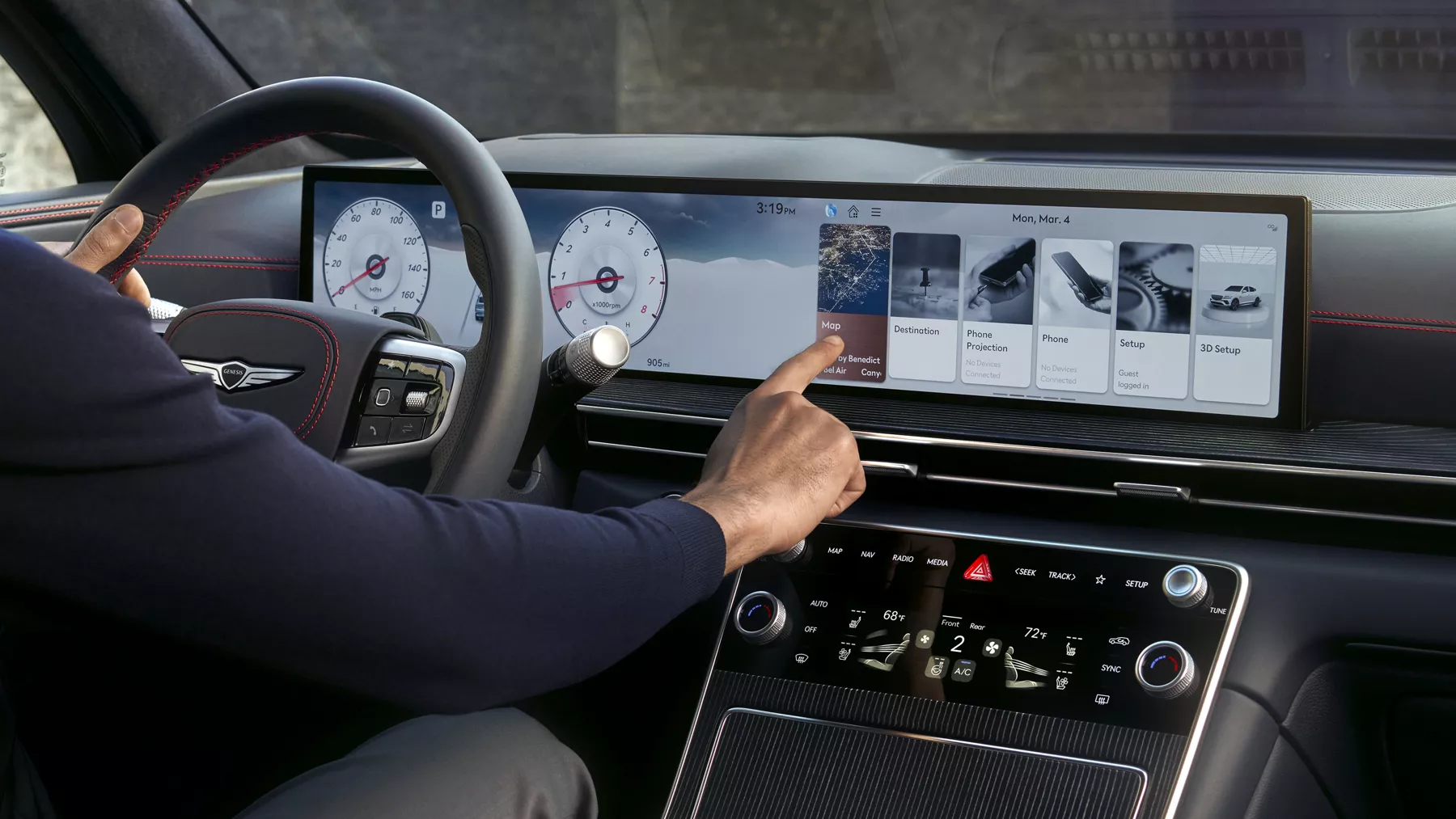Interior view of driver touching the Navigation Integrated display inside the Genesis GV80 Coupe