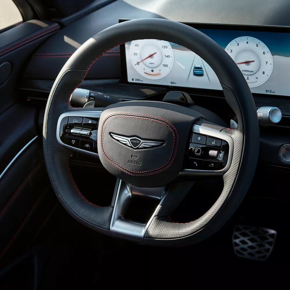 Interior close up D-Cut steering wheel inside the Genesis GV80 Coupe