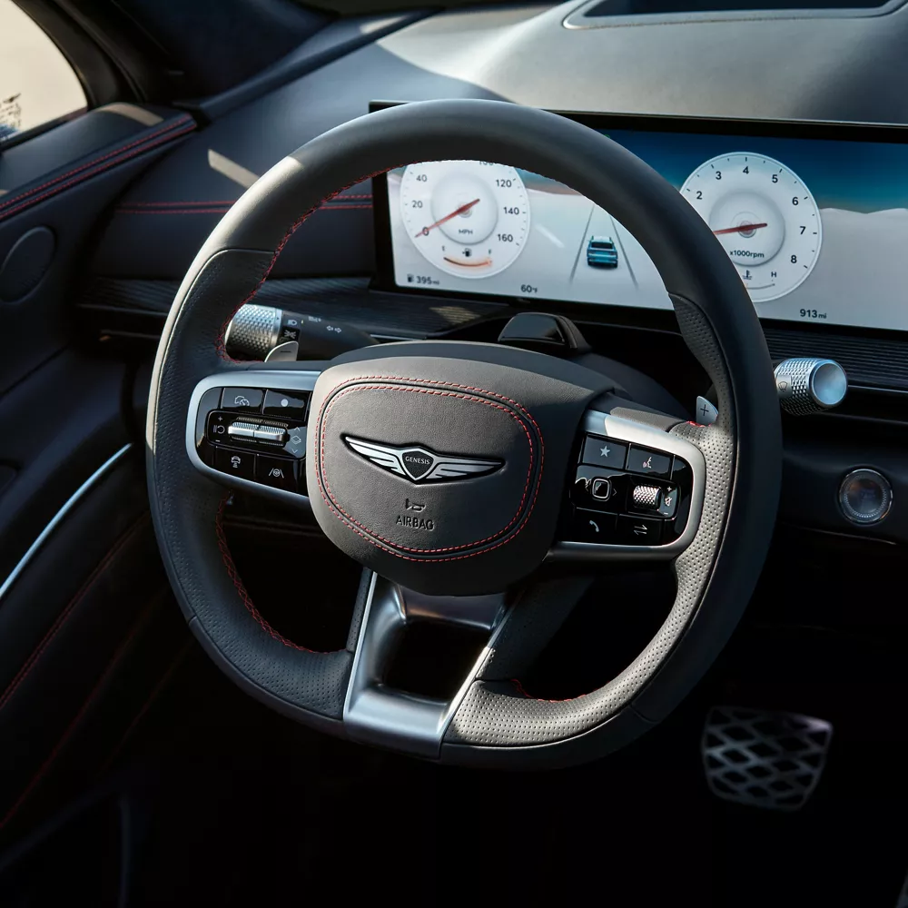 Interior close up D-Cut steering wheel inside the Genesis GV80 Coupe