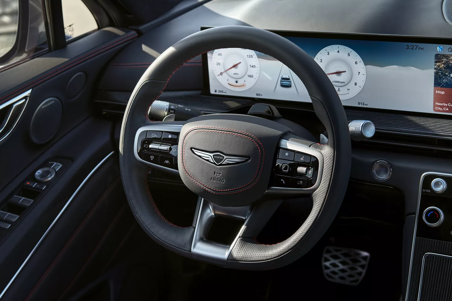 Close up of Ultramarine Blue D-Cut steering wheel inside the Genesis GV80 Coupe