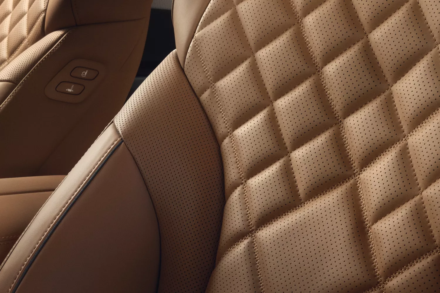Interior close up of tan quilted Nappa leather seating details inside Genesis GV80