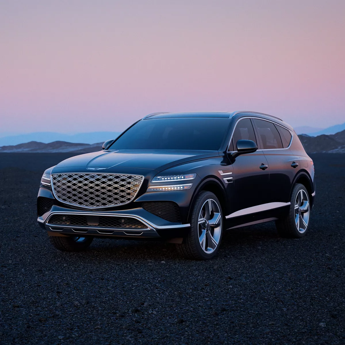 3/4 front driver side view of Genesis GV80 parked in empty desert at dusk