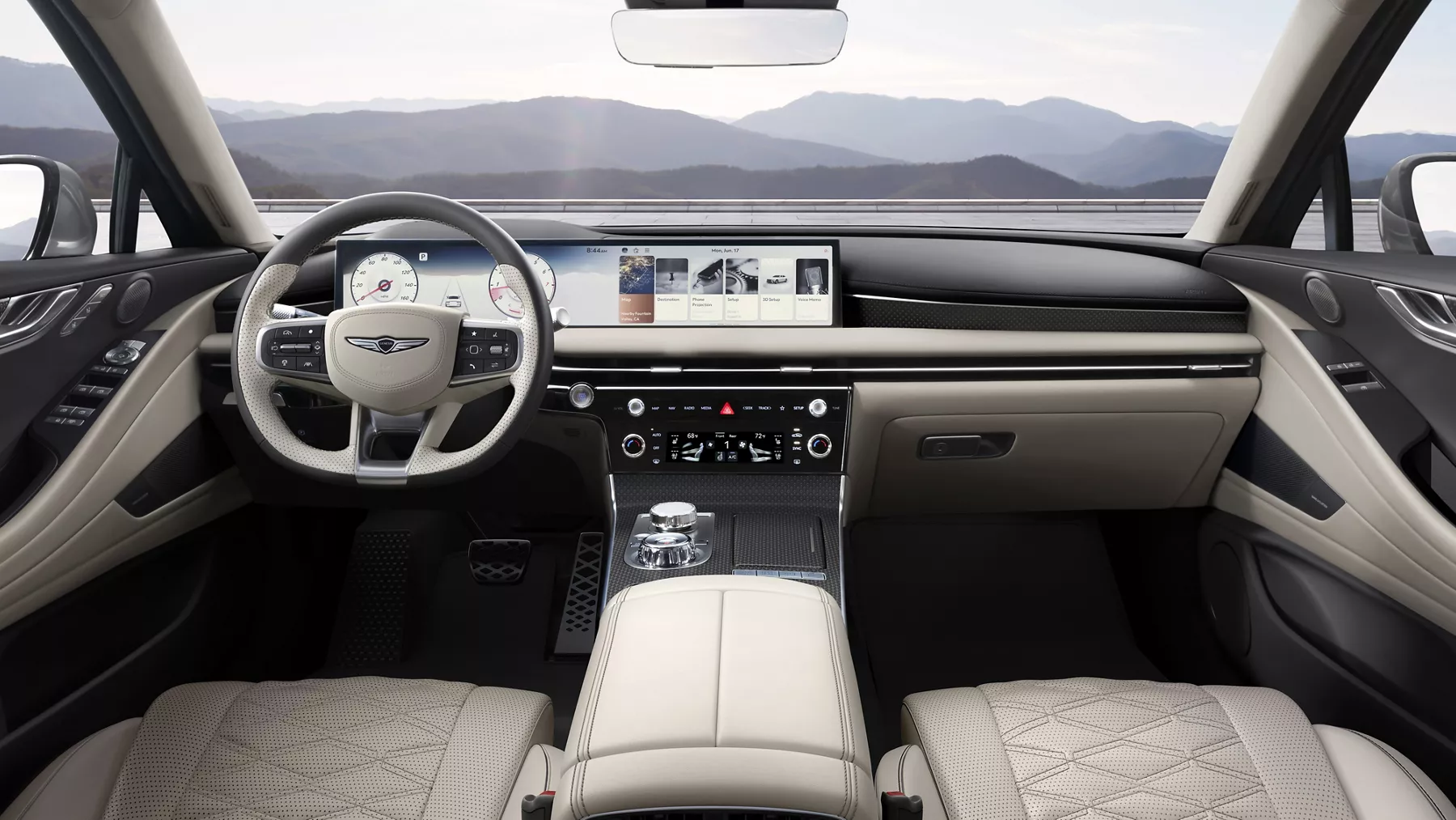 Front interior of Genesis G80 with beige leather, digital dash, and mountain view from back seat pov