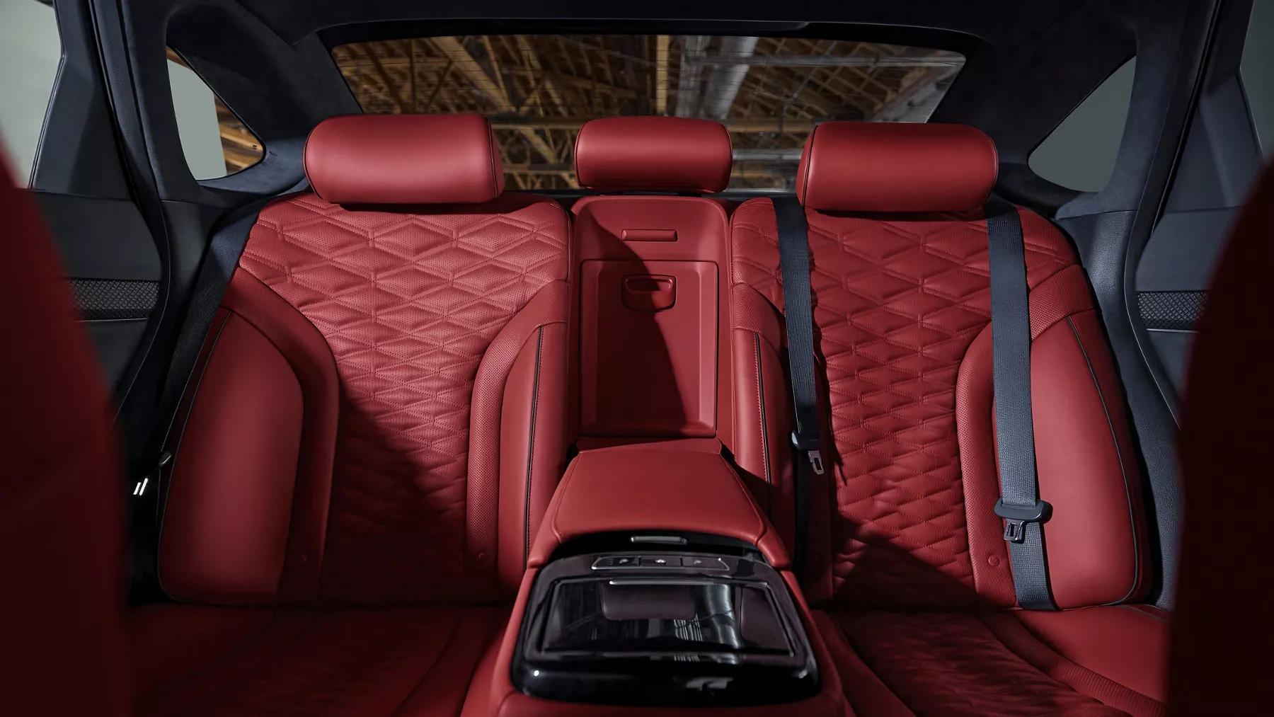 Front seat pov of red Nappa leather rear seats in the Genesis G80