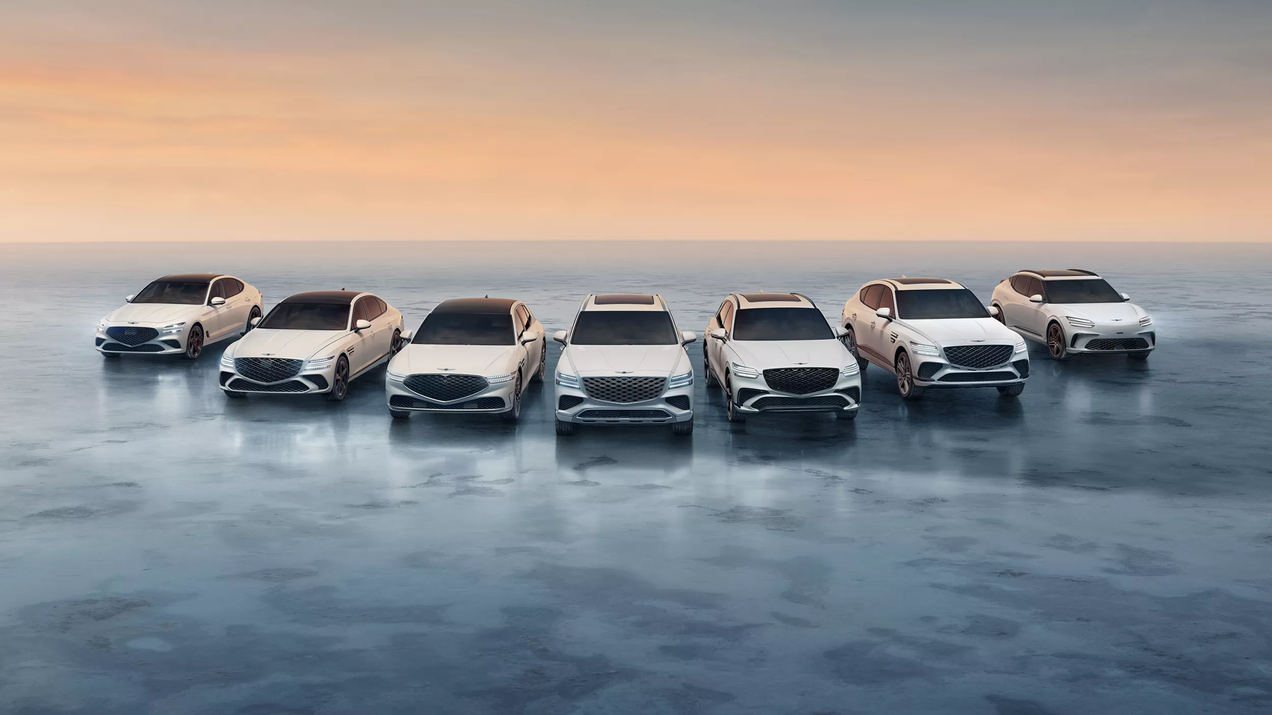 Full lineup of 2026 Genesis vehicles (G70, G80, G90, GV60, GV70, GV80 & GV80 Coupe) parked on ice