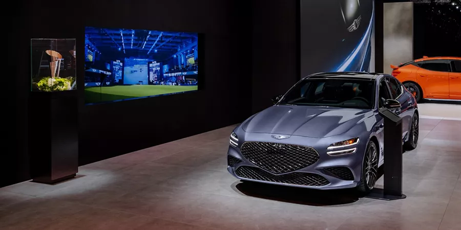 The Genesis Lounge at the 2025 LA Auto Show with Genesis vehicles on display