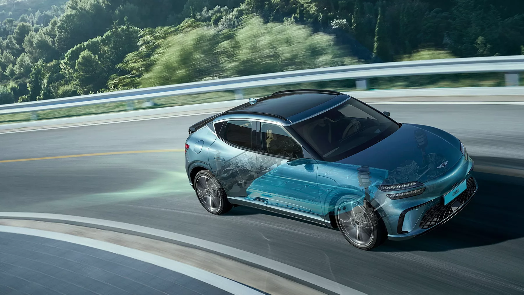 2026 Genesis GV60 on mountain road, with computer generated cross section of suspension system