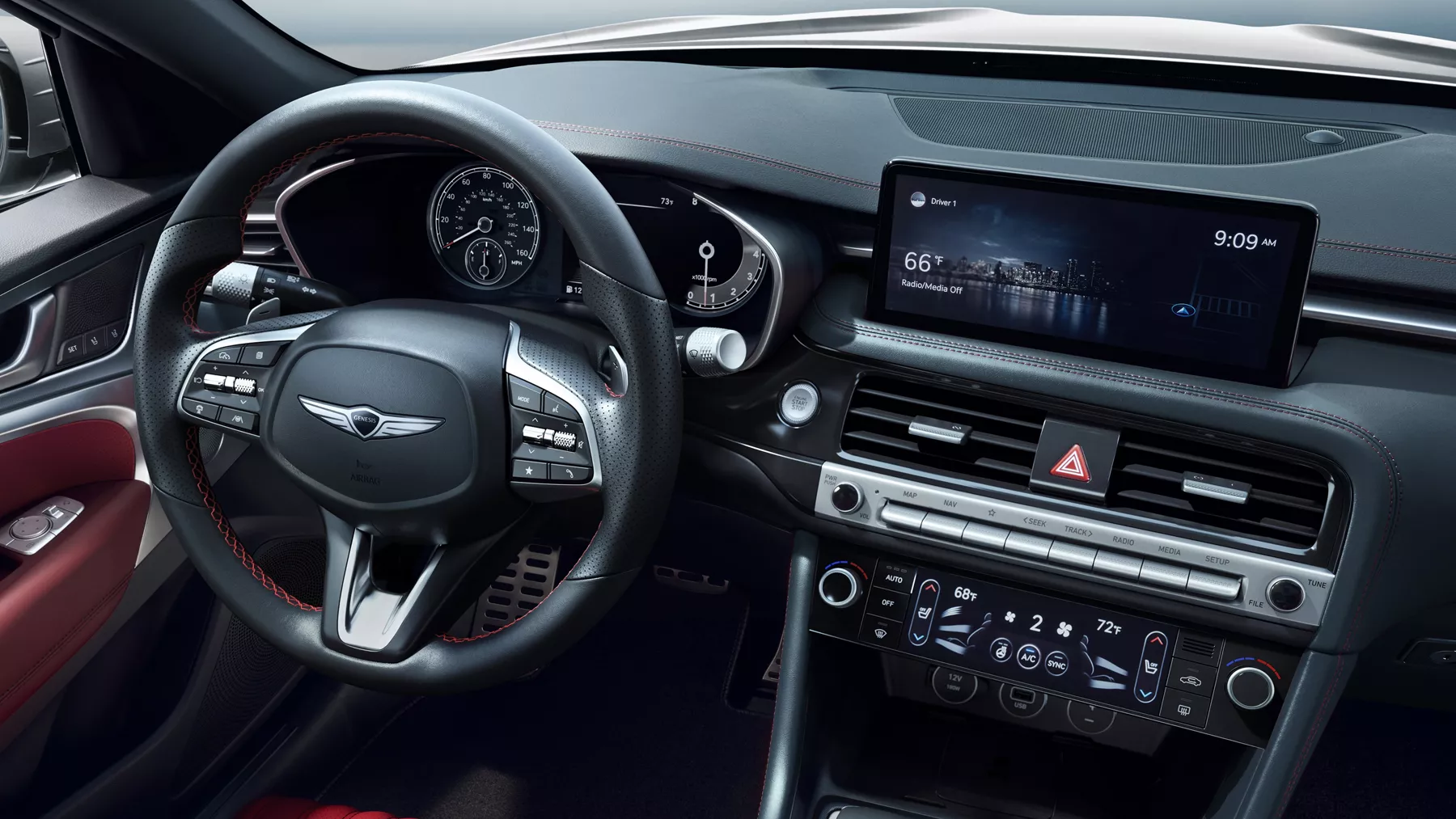 Interior view of Genesis G70 steering wheel and center console