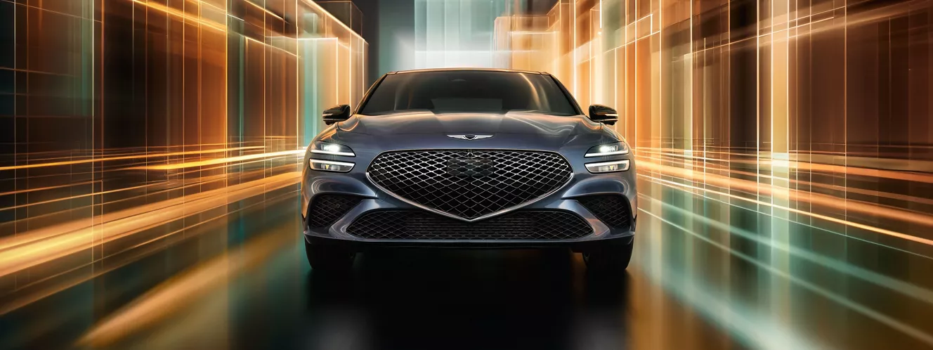 Front facing view of 2027 Genesis G70 Prestige Graphite against colorful digital background