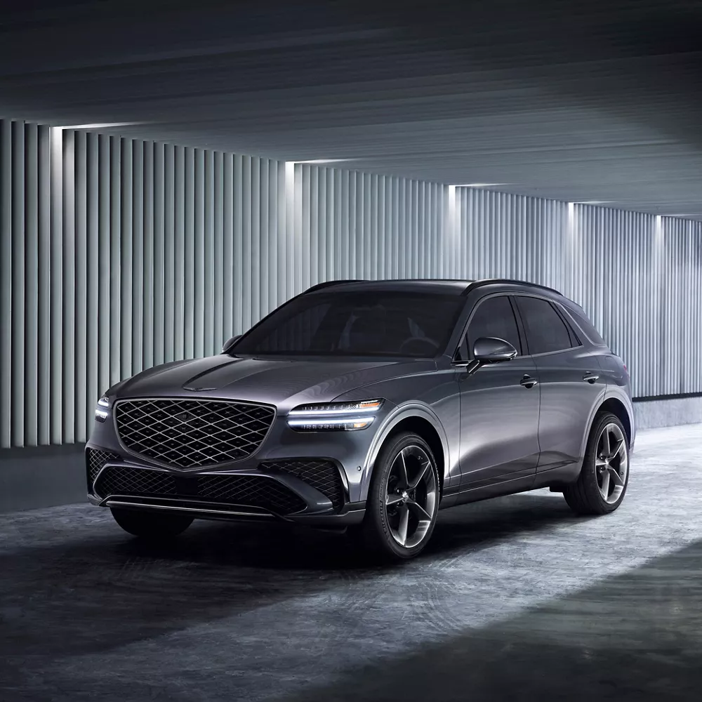 Dark gray Genesis GV70 parked in a garage