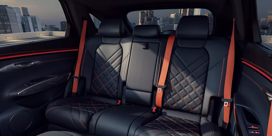 Front-to-backseat view of 2026 Genesis GV70 interior in Obsidian Black & Ultra-Marine Blue