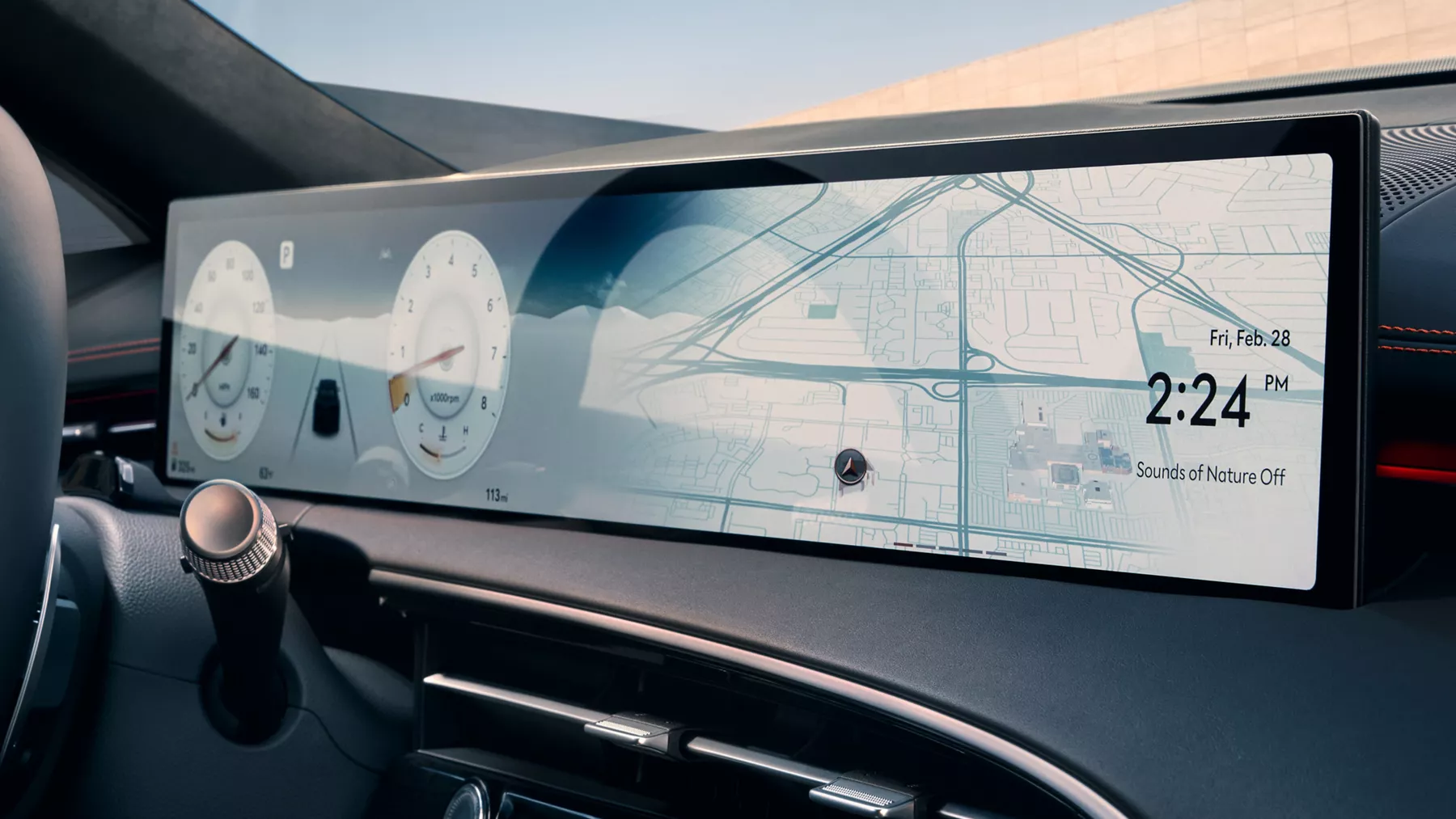 Close-up of 2026 Genesis GV70 27-inch OLED navigation display showing map and digital gauges