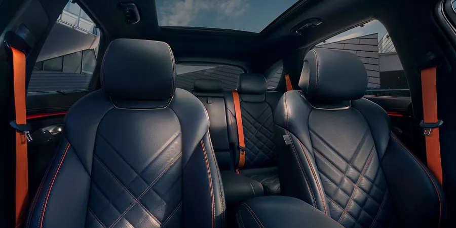 Interior close up of 2026 Genesis GV70 quilted leather seating in Obsidian Black & Ultra-Marine Blue