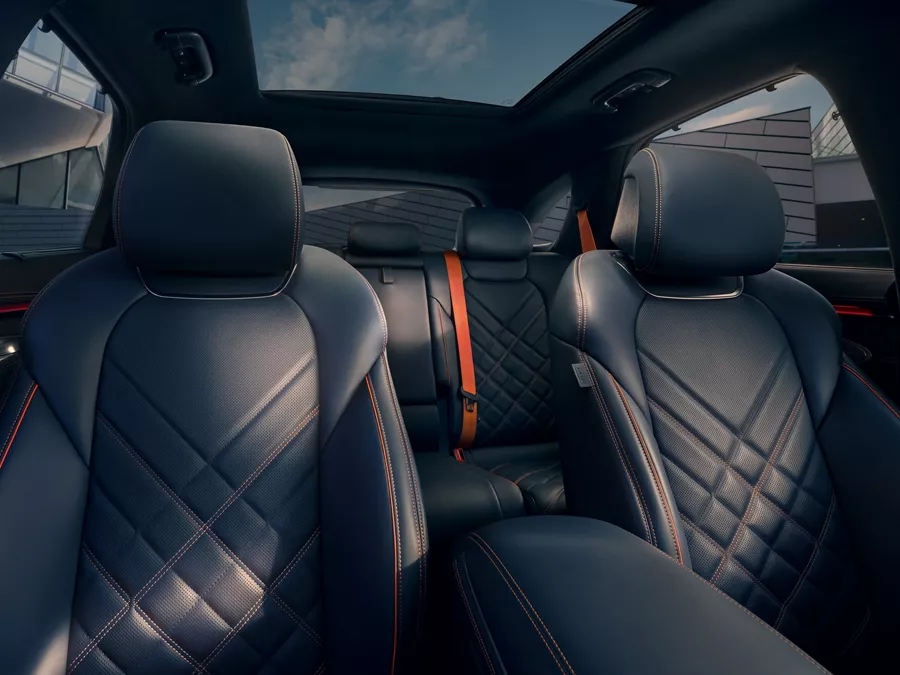 Interior close up of 2026 Genesis GV70 quilted leather seating in Obsidian Black & Ultra-Marine Blue