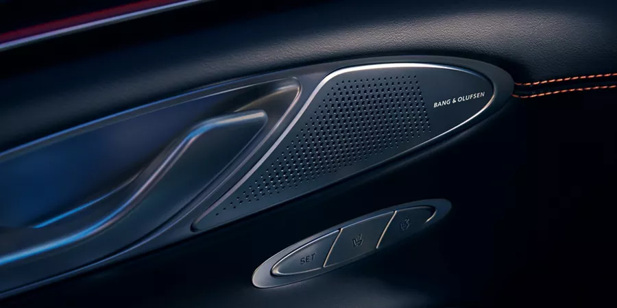 Interior Close up of 2026 Genesis GV70 driver-side door panel showing Bang & Olufsen speaker