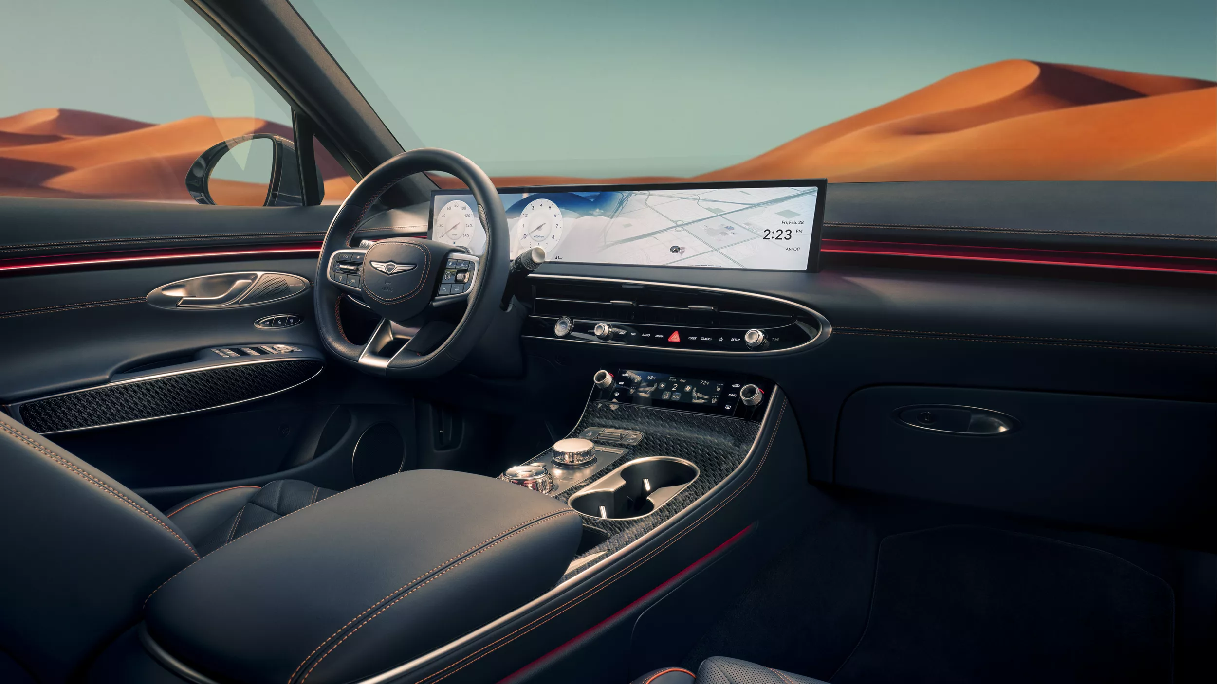 Interior view of blue front seating inside Genesis GV70 with blue sky and mountains in background