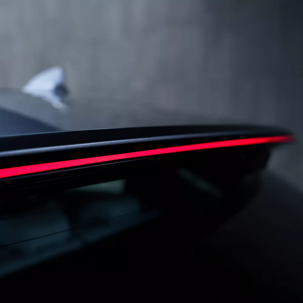 Close-up of Genesis Electrified GV70 rear LED light bar glowing red