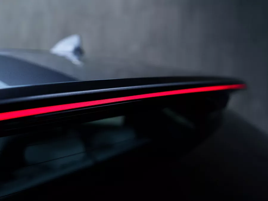 Close-up of Genesis Electrified GV70 rear LED light bar glowing red
