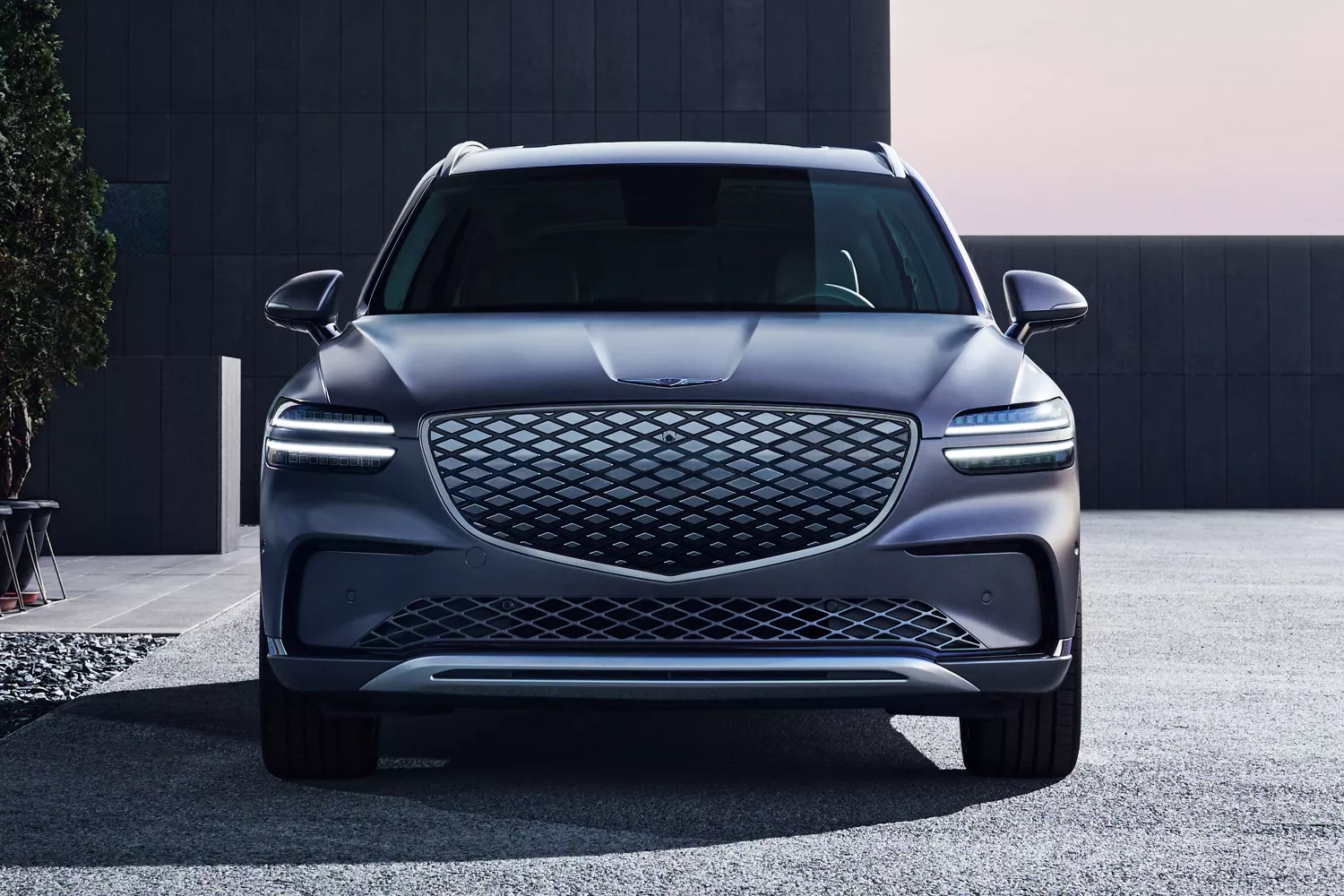 Front facing closeup of Genesis Electrified GV70 in Ceres Blue
