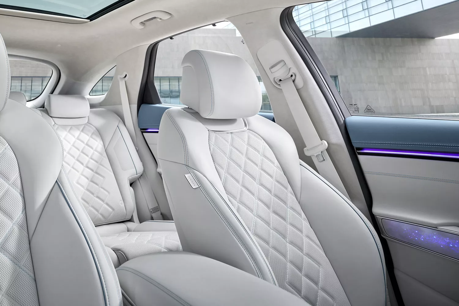 Close up interior view of the Ergo Motion Seat driver seat and rear seats in the Genesis Electrified GV70