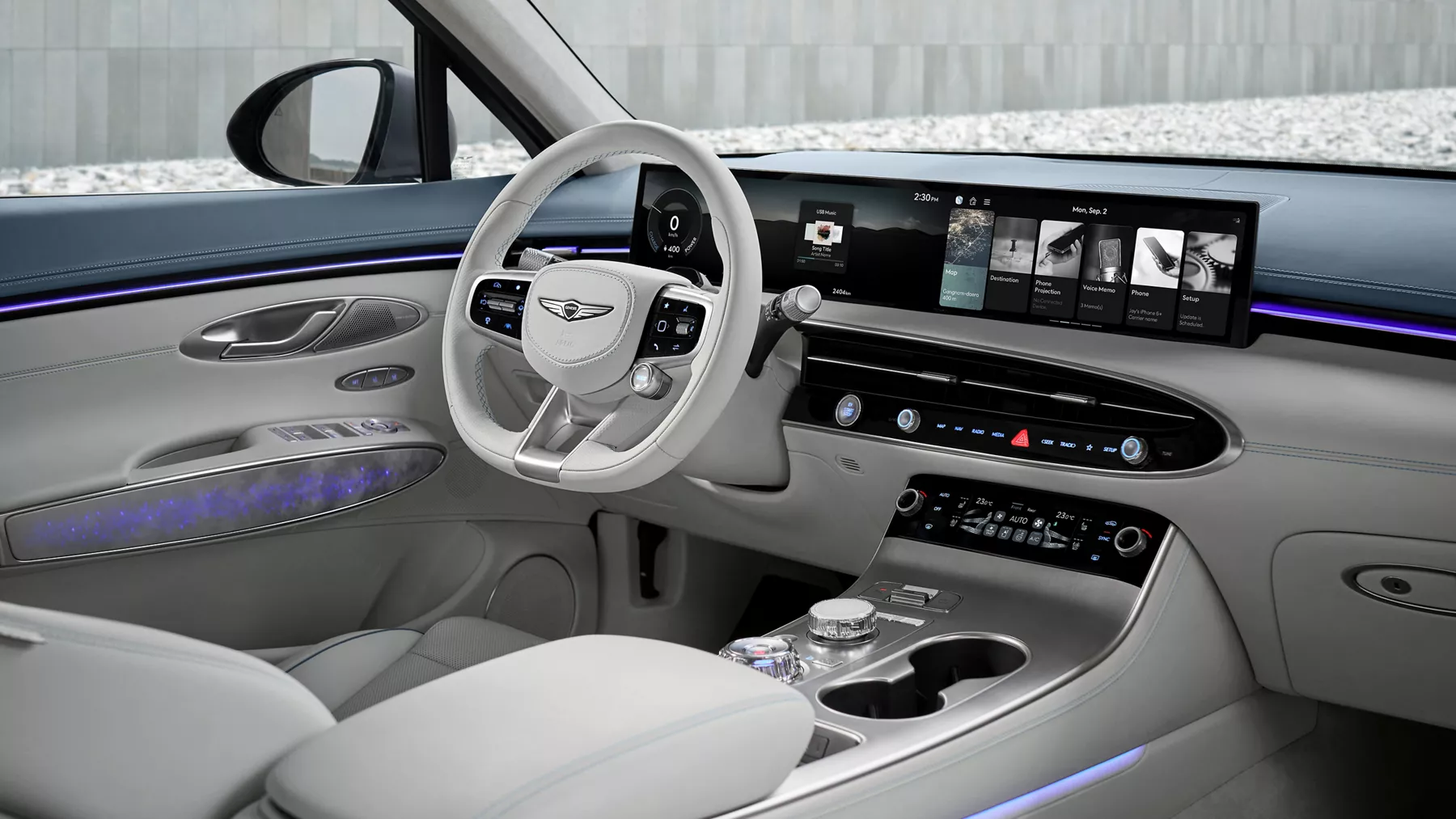 Interior passenger side POV of steering wheel, front dash & front seats in Genesis Electrified GV70