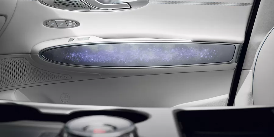 Interior view of ambient lighting and speaker grille on door panel inside Genesis Electrified GV70