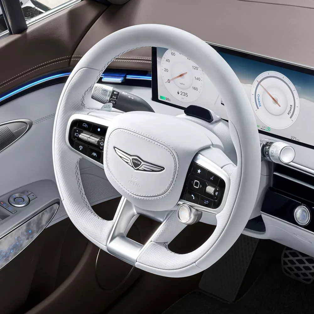 Interior closeup of white nappa leather steering wheel inside Genesis Electrified GV70