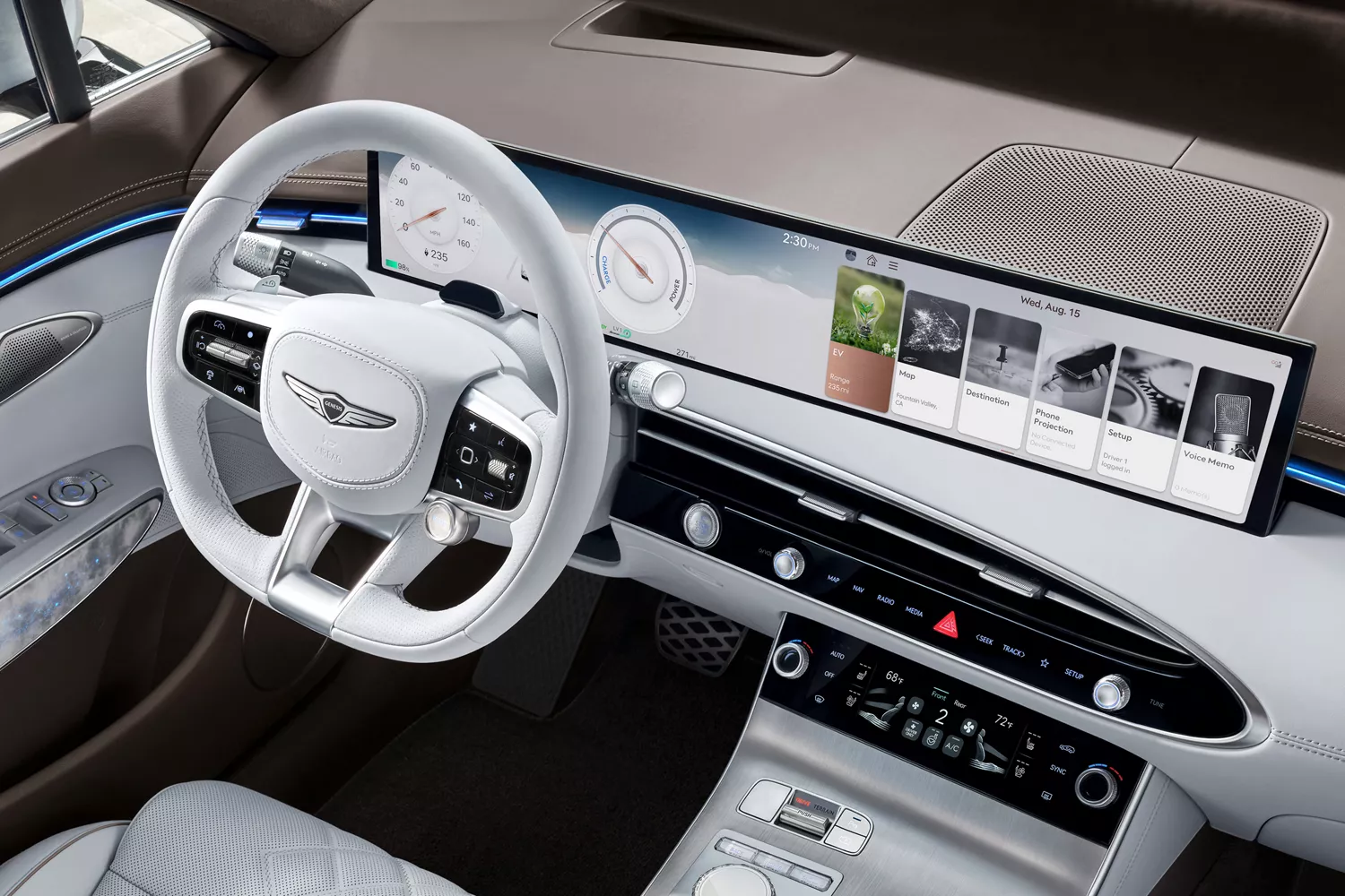 Interior view of steering wheel and infotainment screen inside Genesis Electrified GV70