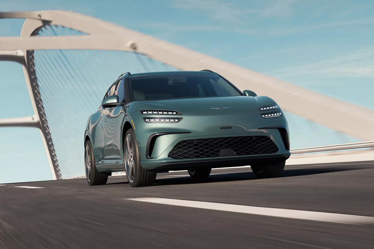 3/4 front passenger side view of Tromso Green Genesis GV60 driving across modern suspension bridge