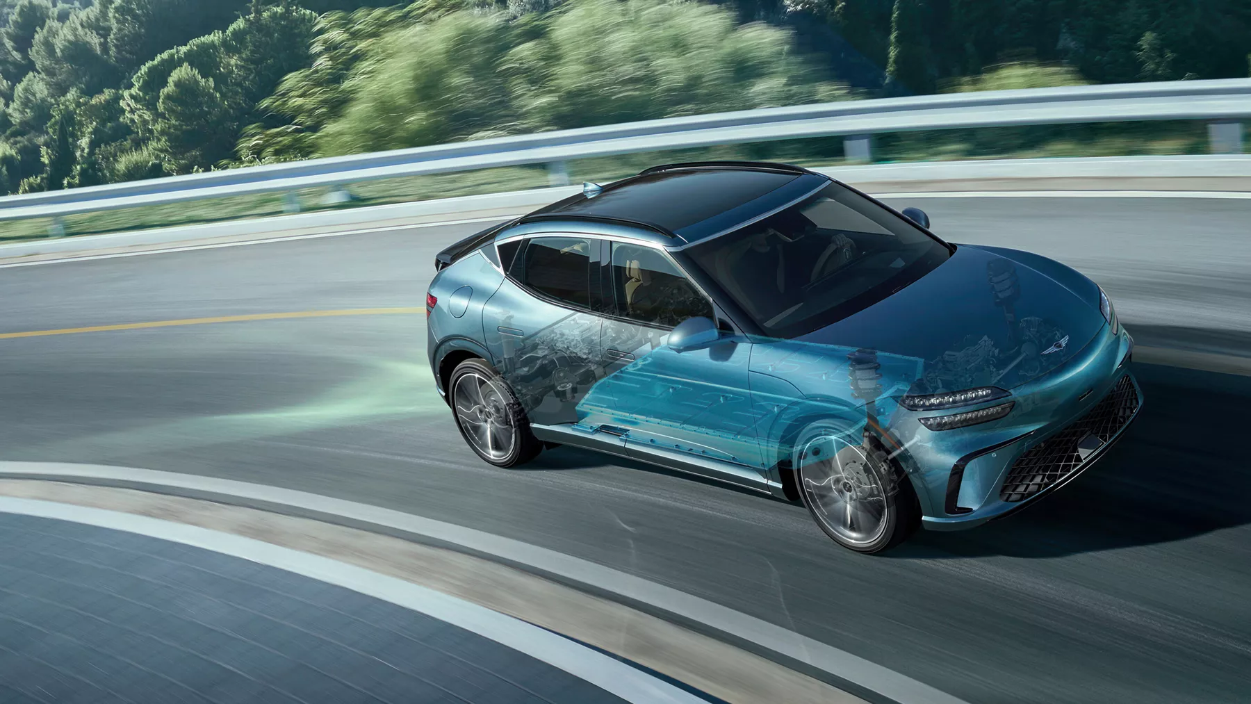 2026 Genesis GV60 on mountain road, with computer generated cross section of suspension system