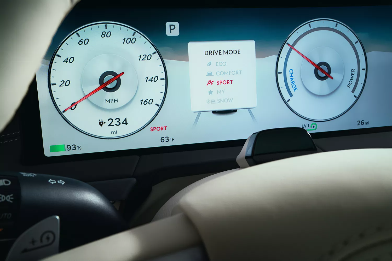 Interior close up through steering wheel of Sport Mode selected on OLED display, inside Genesis GV60