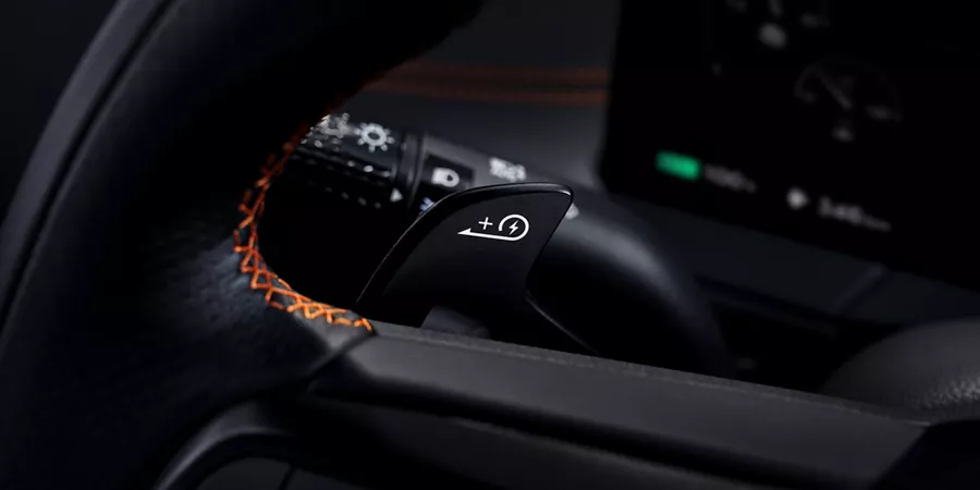 Interior close up of paddle shifter on steering wheel inside 2027 Genesis GV60 Magma