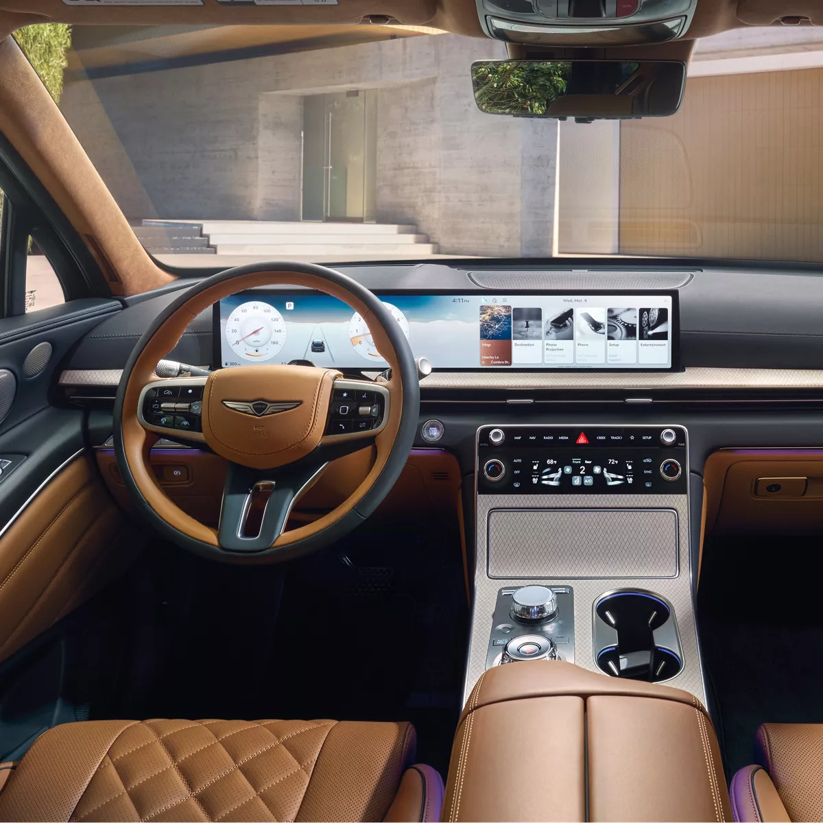 Interior driver pov of 2026 Genesis GV80 front dashboard, vehicle parked at modern home