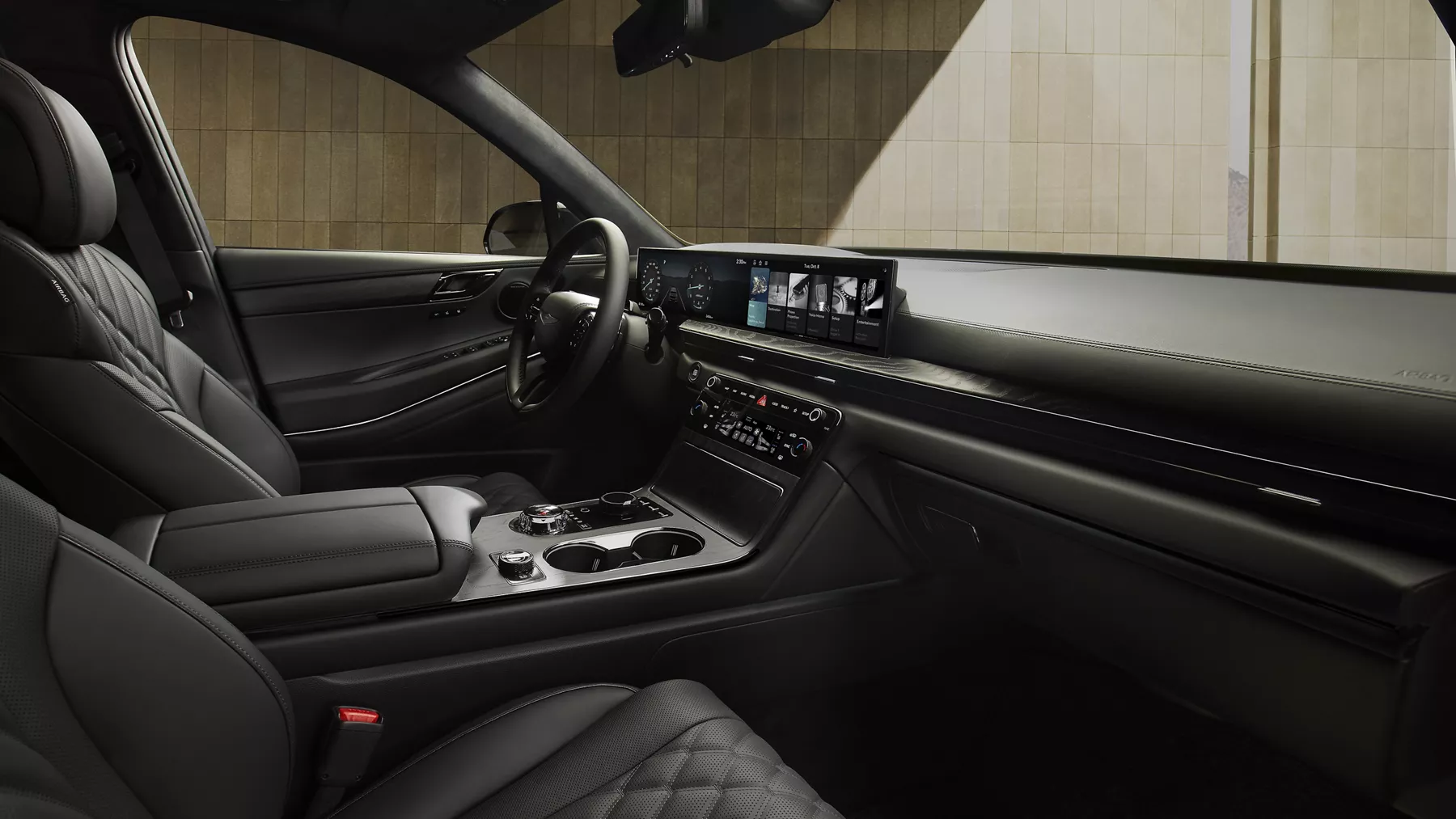 Interior view from the front passenger POV of the front seating in the Genesis GV80 Prestige