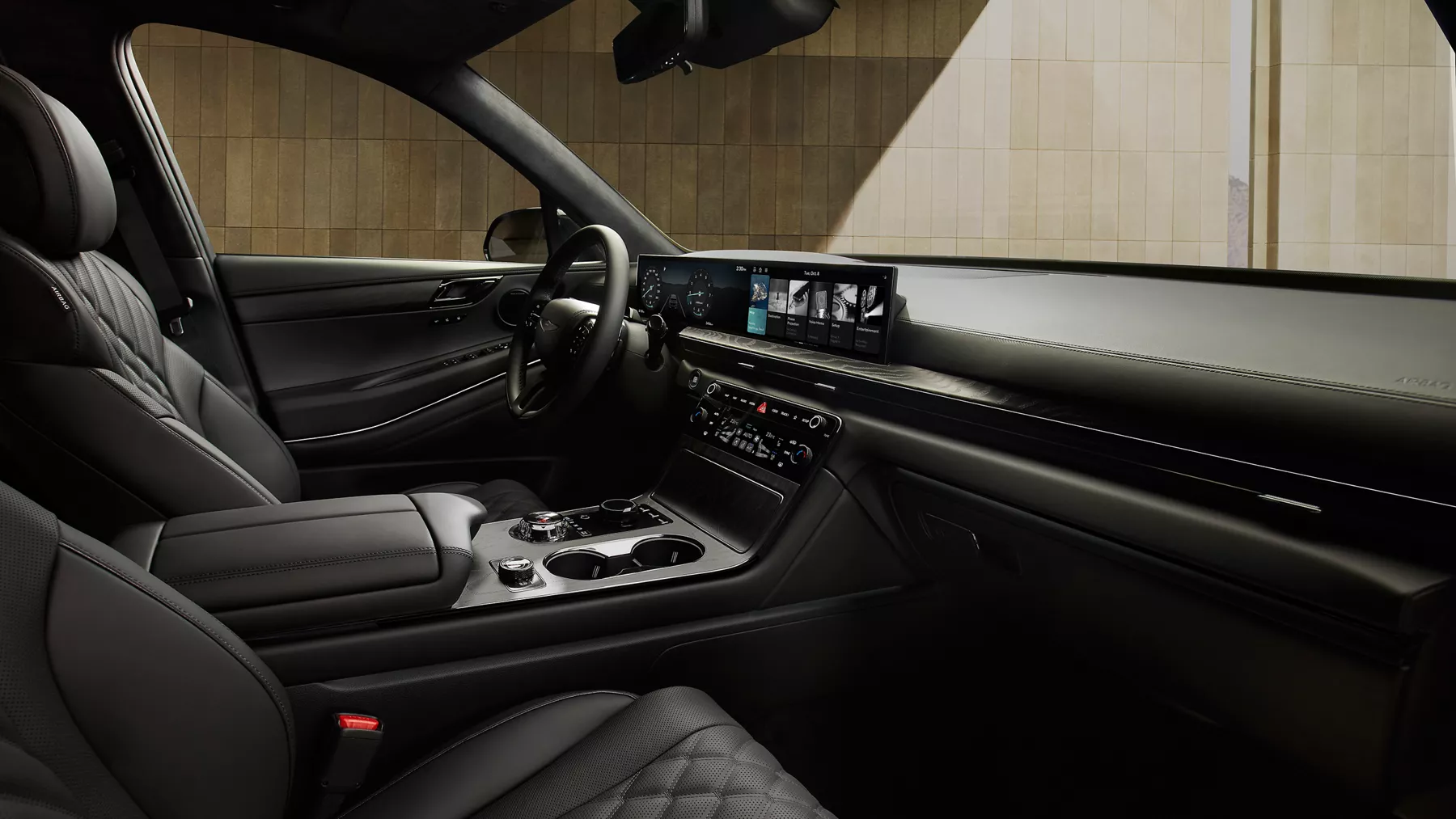 Front interior passenger POV of front seating in the Genesis GV80 in Prestige Black
